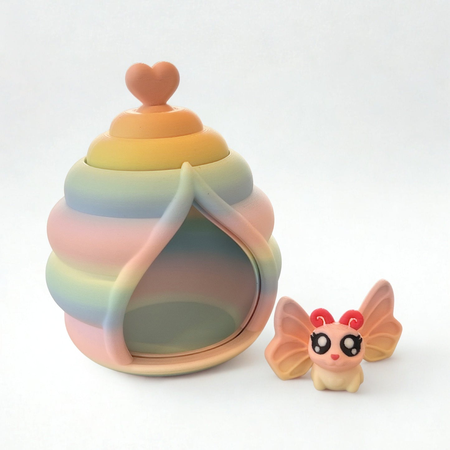 Mini butterfly toy and butterfly house with revolving door.