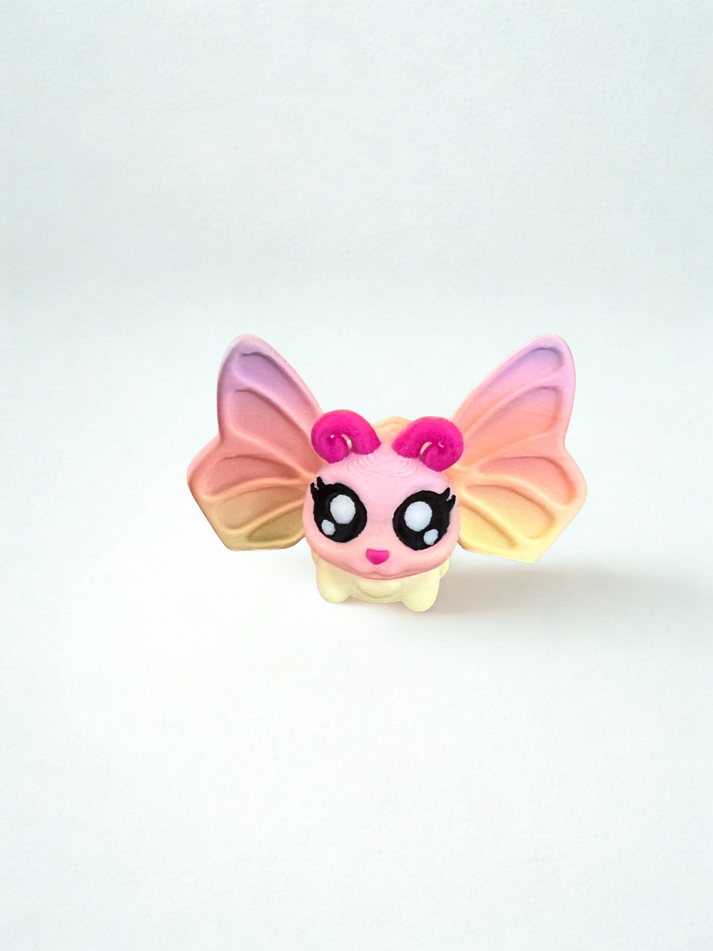 Mini butterfly toy and butterfly house with revolving door.