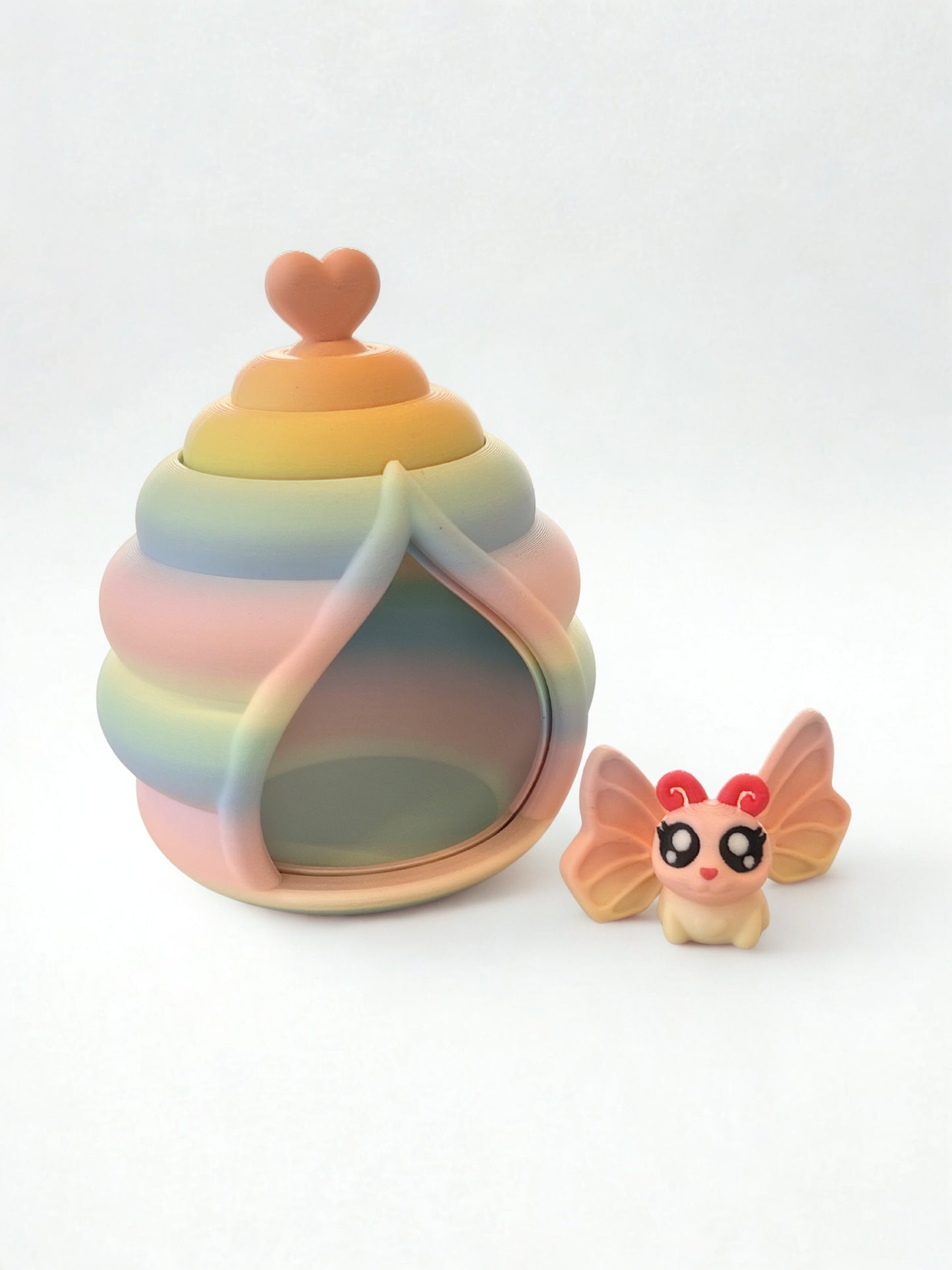 Mini butterfly toy and butterfly house with revolving door.